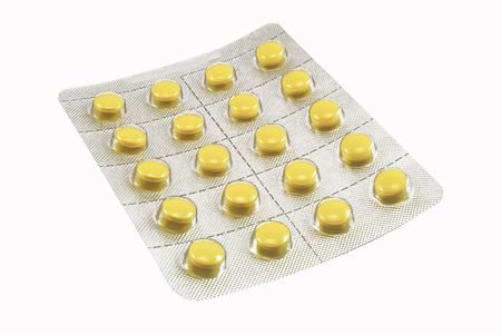 Pack of pills isolated on white の写真素材