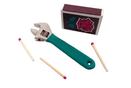 Wrench and matches on a white backgroundの写真素材