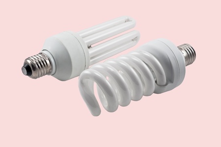 Economy lamp isolated on green backgroundの写真素材