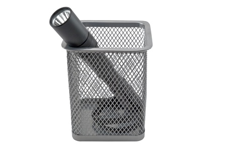 flashlight in empty containers of pencils isolated on a whiteの写真素材