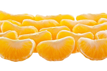 Slices of peeled orange on white backgroundの写真素材