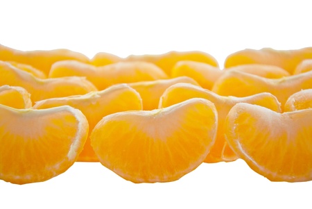 Slices of peeled orange on white backgroundの写真素材