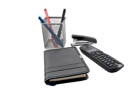 Notebook, pen and telephone on a white backgroundの写真素材