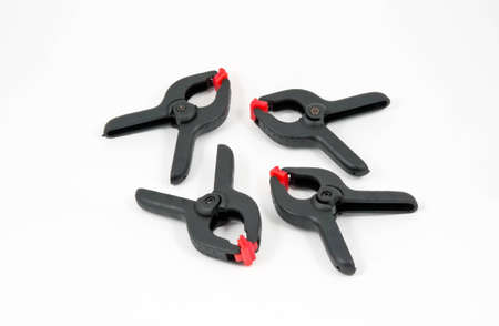 Plastic mechanical hand vise clamp, isolated on white background
