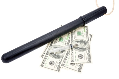 medical syringe, paper money and Rubber baton a white backgroundの写真素材