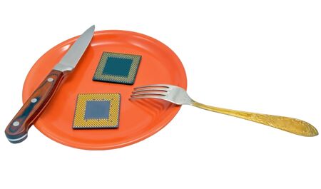 CPU, knife, fork on the red plateの写真素材