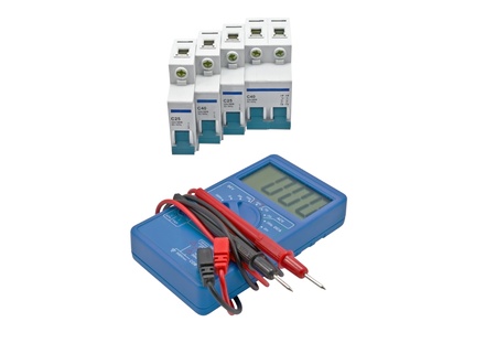 Automatic circuit breaker and Digital multimeter on a white background