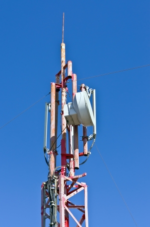 Tower with aerials of cellular on a background blue skyの写真素材