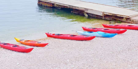 Colorful kayaks on the beach of Balaklava cityの写真素材
