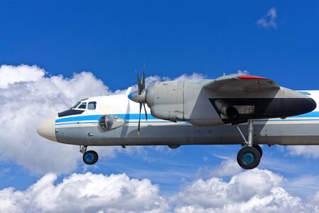 the old turboprop airplane on sky background