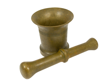 Brass mortar with a pestle isolated on a white backgroundの写真素材