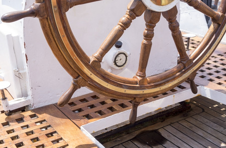 Old boat steering wheel from brass and woodの写真素材