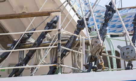 Reeled ship ropes hanging on the spools   