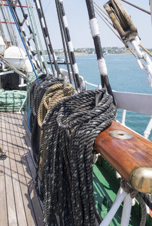 Reeled ship ropes hanging on the spools   