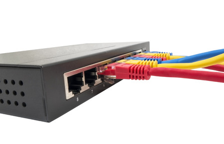 Closeup of network cables connected to router on white