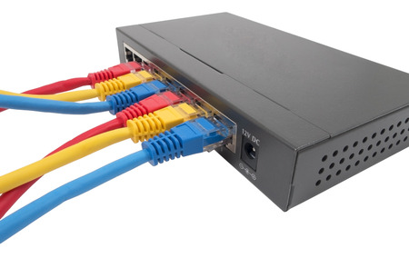 Closeup of network cables connected to router on white