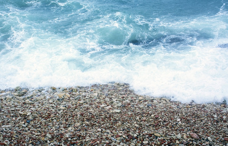 The small smooth multi-coloured sea stonesの写真素材