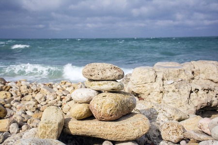 Figures from stones on background a sky and mountainの写真素材