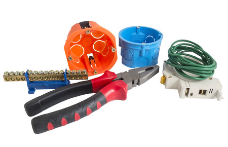 Electrician tools, cable, box for installation of sockets and disassembled outlet before installing