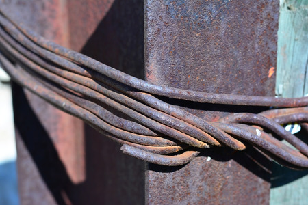 the steel wire rope on rusty railsの写真素材