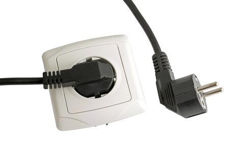 electrical plug in the electric socket on white background