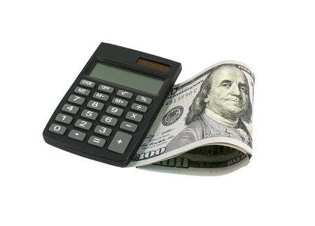 Calculator and dollars isolated on a white backgroundの写真素材