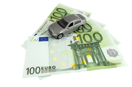 car on money cash on white backgroundの写真素材