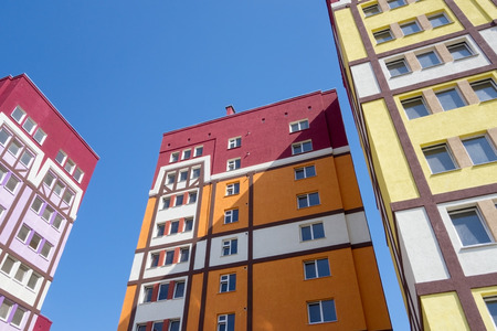Modern, new executive apartment building in city on background of blue skyの写真素材