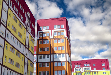 Modern, new executive apartment building in city on background of blue skyの写真素材