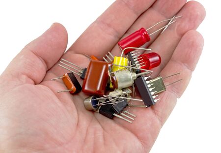 Miniature elctronic circuit board on hand on white backgroundの写真素材