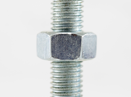 Bolt and nut isolated on white backgroundの写真素材