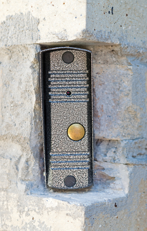 the intercom button in the wall of the houseの写真素材