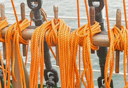 Reeled ship ropes hanging on the spoolsの写真素材