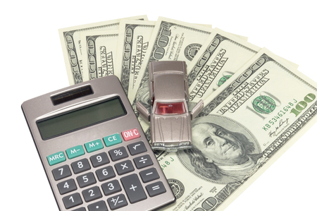 Car money and calculator on white backgroundの写真素材