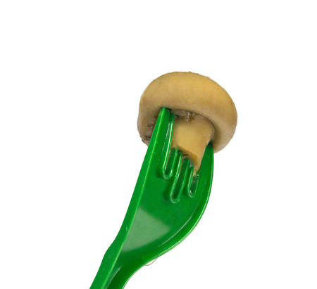 mushroom on fork, isolated on white backgroundの写真素材