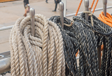 Reeled ship ropes hanging on the spools