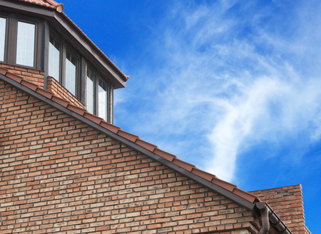 Modern, new executive apartment building on background of blue skyの写真素材