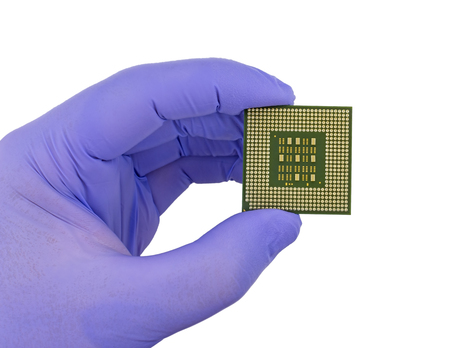 hand in glove and computer processor chip (CPU) isolated on white background
