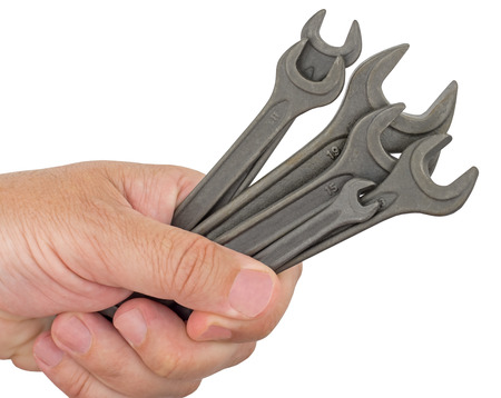 chrome vanadium wrenches in the hand on white backgroundの写真素材