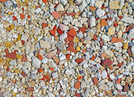 Small rocky cover the sea coast. Texture, background