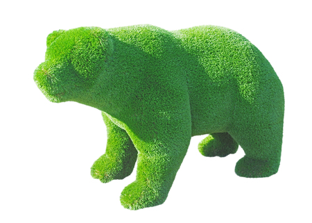 figure of a bear made from decorative grass on white backgroundの写真素材