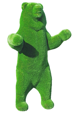 figure of a bear made from decorative grass on white background