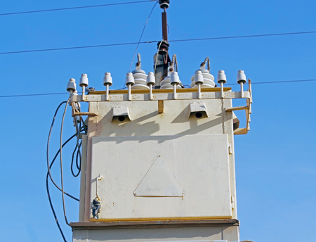 electric tower high voltageand high voltage transformer post with green forest