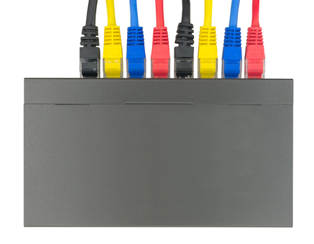 Multicolored network cables connected to router on a white background