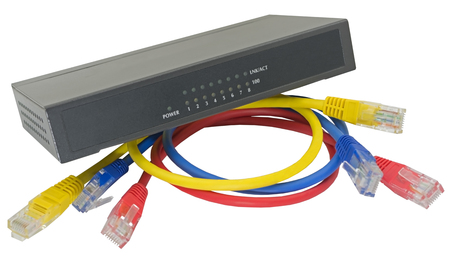 Multicolored network cables connected to router on a white background