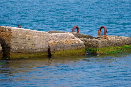 Breakwater on a background sea
