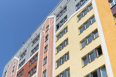 Modern panel apartment building with plastic windows and insulated walls