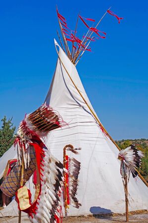 the Summer camping tent, Indian wigwam hut and Indian hat with feathers