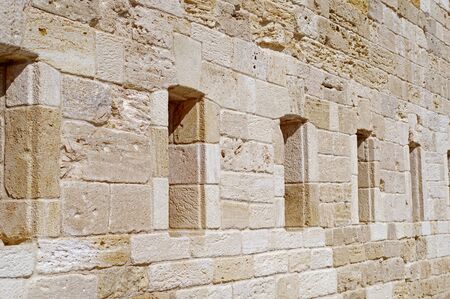 Gun loopholes in the old wall of the fortification of the nineteenth centuryの写真素材