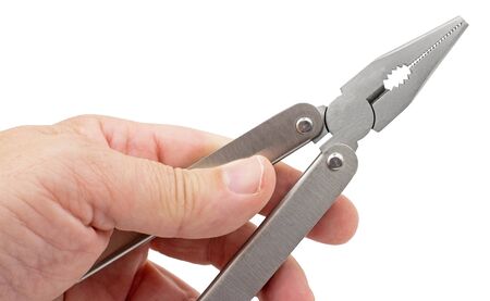 Hand is holding universal pliers on white background